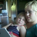 Reading to my daughter the book I wrote {My Mommy is a Blogger}.