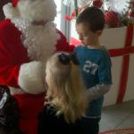 The children giving Santa their wish list.